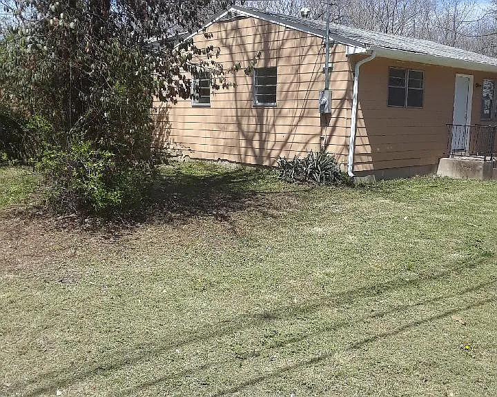 Side View Showing the Large Property and Spacious Lawn