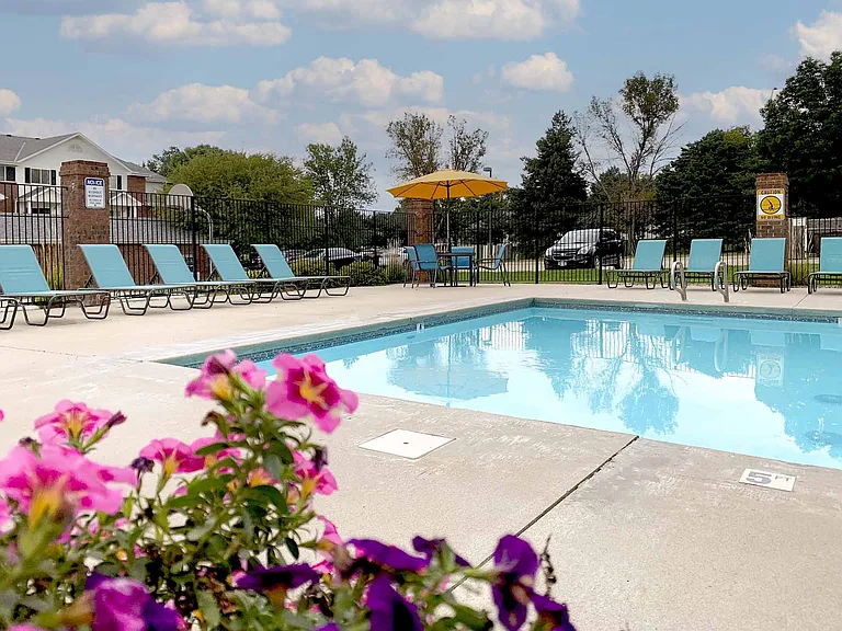 Relax poolside on comfortable lounge chairs, the perfect spot to enjoy sunny days.