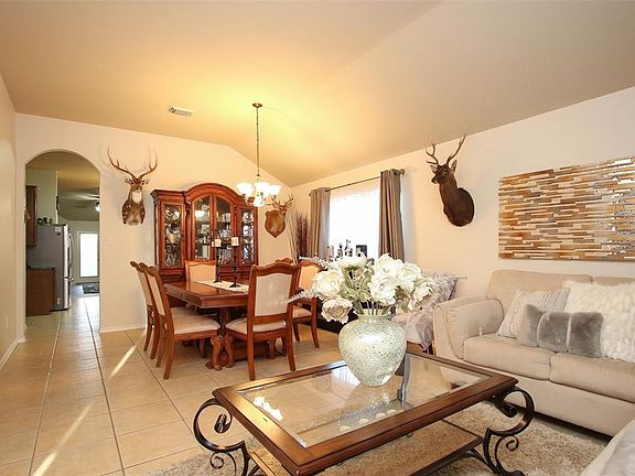 Upon entering you find a lovely corridor showcasing beautiful tiled floors, elegant archways, high ceilings, your lovely living room, and gorgeous dining room!