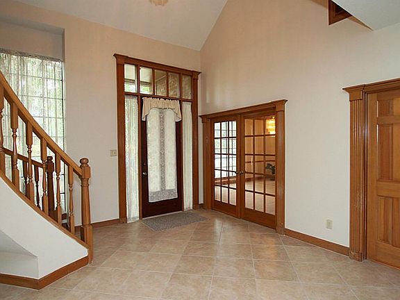 Enter on to a recently tiled two story entry.