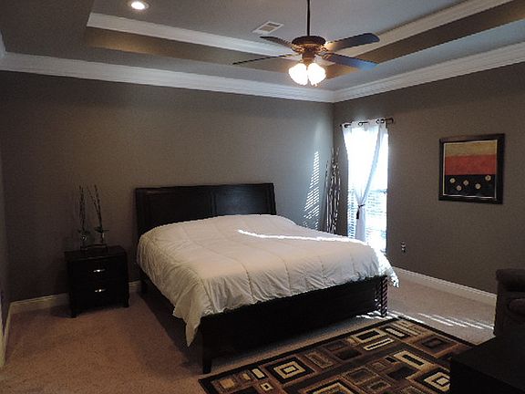 Master bedroom with carpet