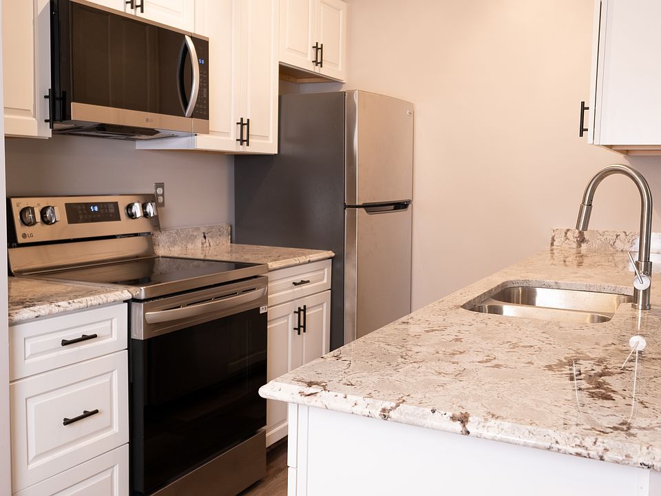Kitchen with new appliances and granite counter tops.