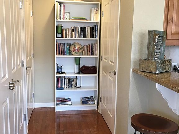 Hallway to half bath and basement