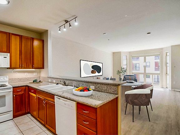 Spacious Living room/ kitchen perfect for entertaining friends or clients-Virtually Staged