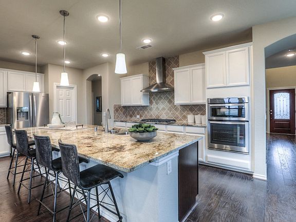 Open concept kitchen with eat-in bartop