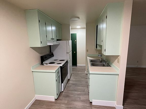 Kitchen from the dining area, looking toward the entrance hallway