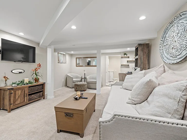 Sofa/double bed with smart tv, ceiling height is below 7 feet.