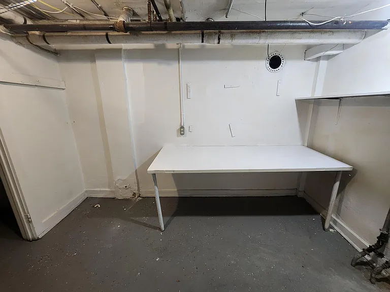 Basement lower unit laundry room table.