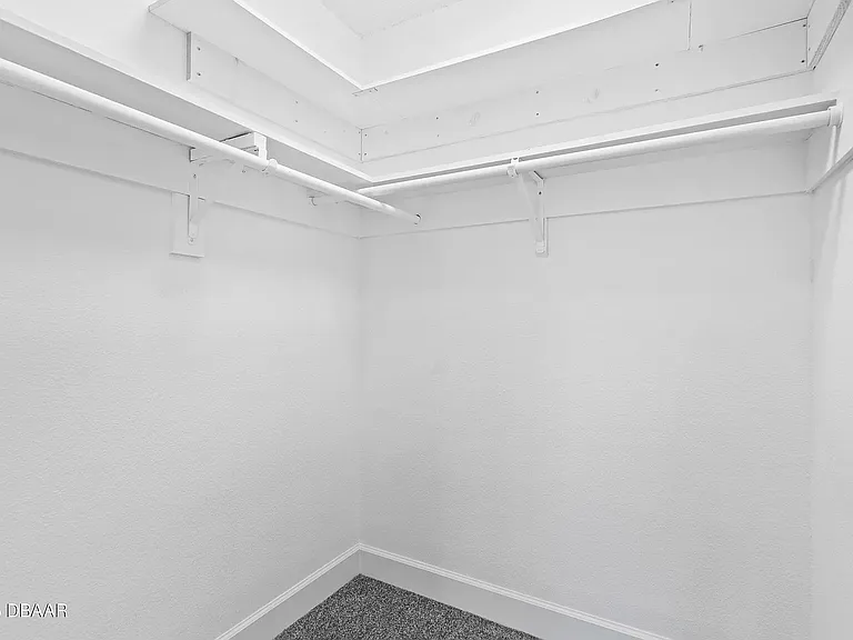 Walk in closet in Bedroom 1 (carpeted)