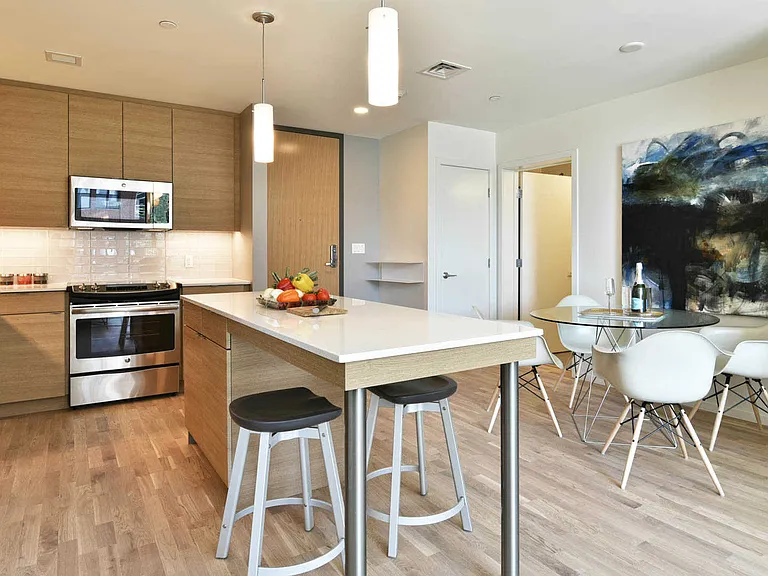 Kitchen with Glass Tile Backsplash and Stainless Steel Appliances
