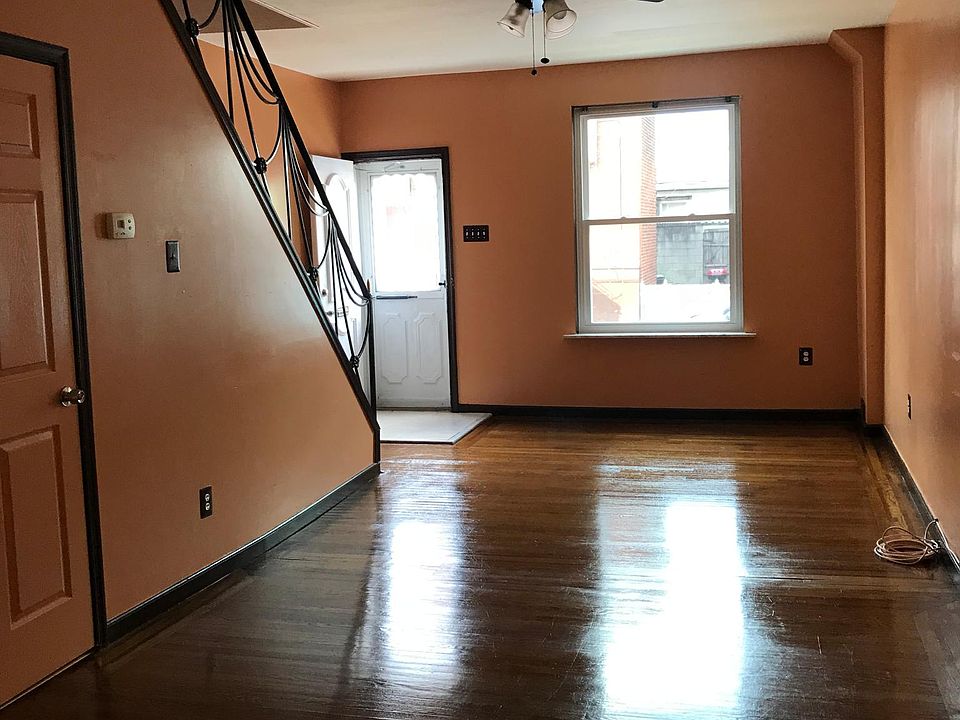 Living room with hardwood floors and new windows