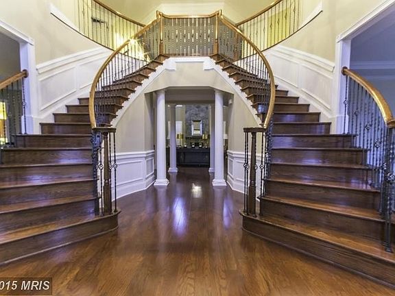 HW in foyer with gorgeous butterfly stairs