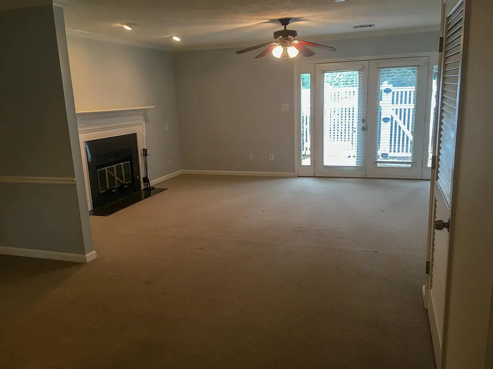 Living room, with french doors opening up to a private patio