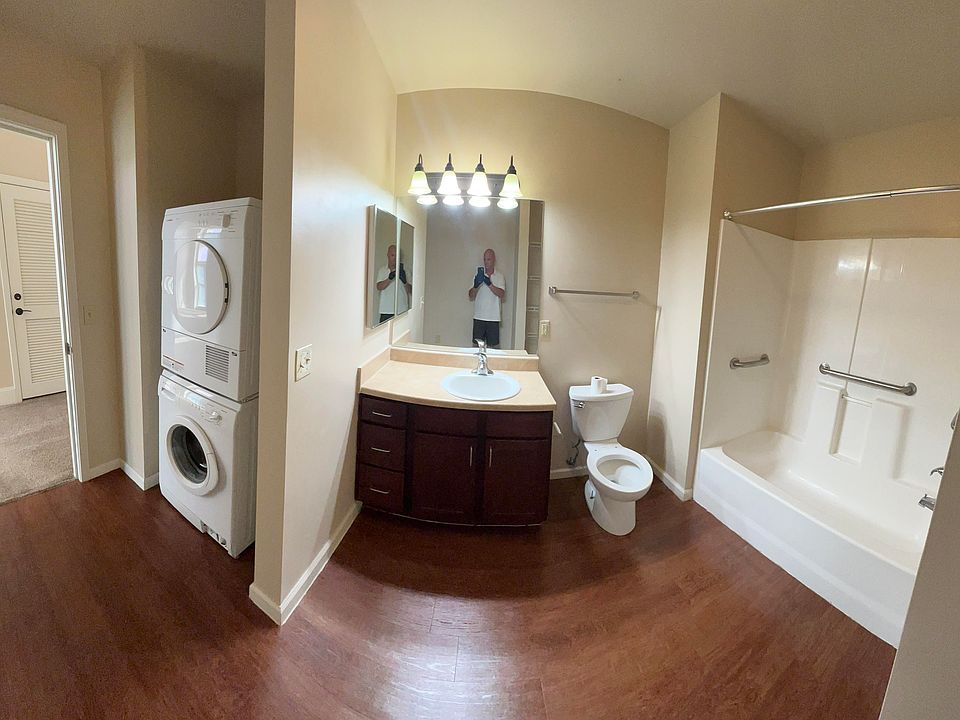 Bathroom area with shower and washer/dryer area