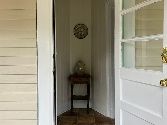 Front entry, Front bedroom to right has with 2 closets and lots of natural light. Living room is to the left.