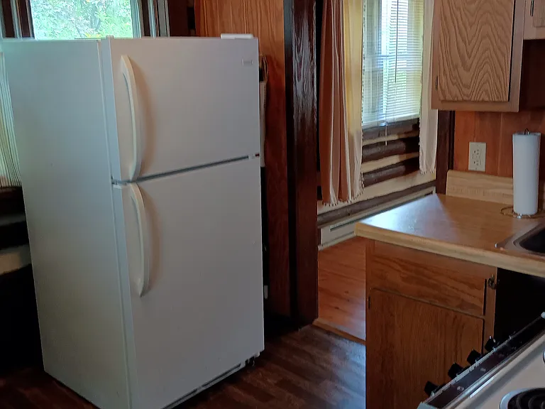 Kitchen with refrigerator.