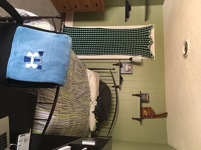 Bedroom #1 shown with twin size bed. The great part of this is the walk in closet.
