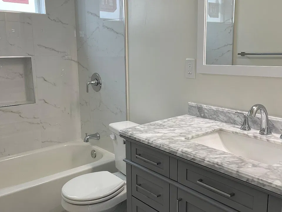 Brand new bathroom with marble counters