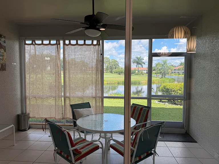 Enclosed lanai for expanded living area. Million dollar view overlooks the lake and 6th par 3 green. Eastern exposure.