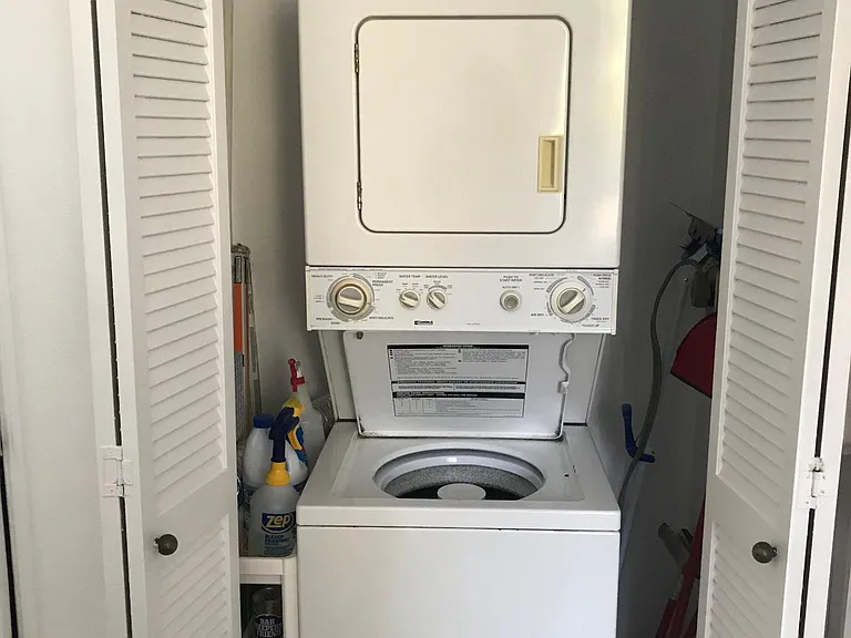 Washer/dryer combo in the bedroom can handle most everything but the bed comforter. It is hidden behind the doors when not being used.