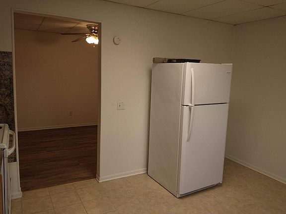 1st floor kitchen 
Fridge 
Tile flooring