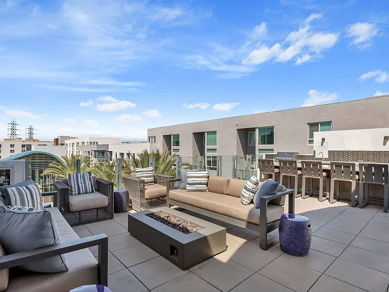 Lounge into the evening on our Rooftop deck with lounge seating and grilling stations