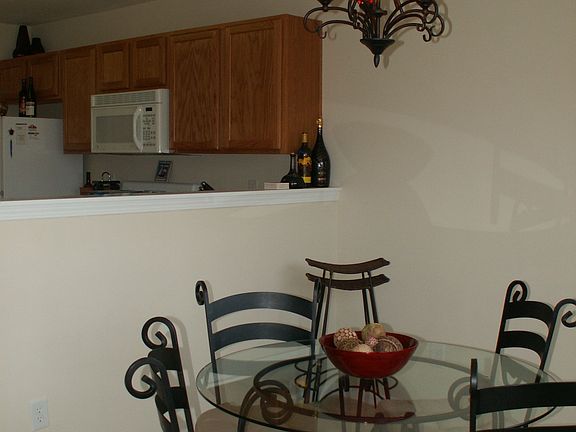 Well-lit dining room and kitchen