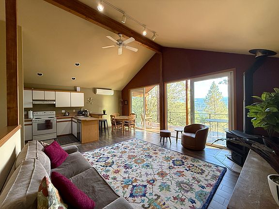 The large sliding glass doors bring the outdoors in while solid sidewalls help maintain the private, cozy feel.