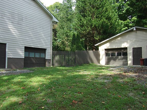 view of house and detached garage from driveway