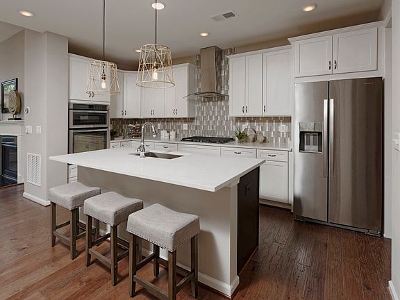 Beautiful Gourmet Kitchen with White Cabinetry