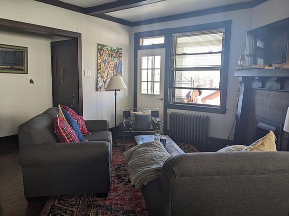 Opposite view of Living room, looking out onto the large covered porch with great views.