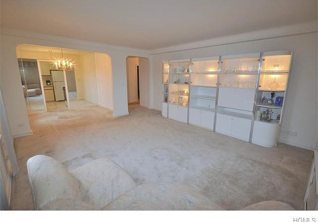 The large living room has both Southern and Eastern exposures and covered hardwood floors. There is 