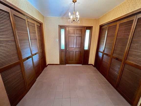 Foyer with large double closets for storage