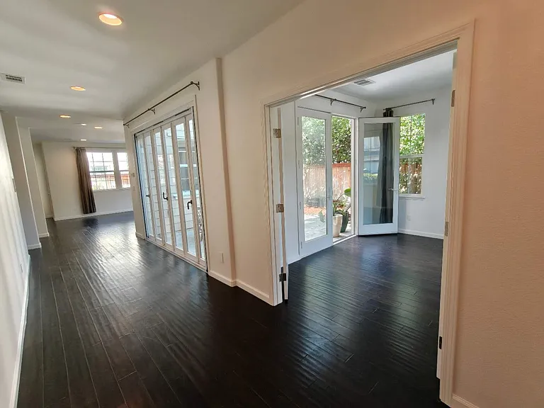 newly added 4th bedroom/bonus room/office featuring elegant French doors opening directly to the private side courtyard