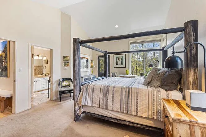 Ensuite bedroom with king bed on main level