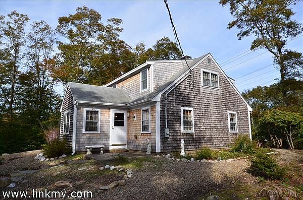 Cape Style home with low maintenance landscaping