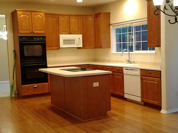 Gourmet Kitchen _ double ovens, full pantry, slide out shelving, island seats 4, Kitchen desk area lighted, hardwood flooring, storage, storage, storag