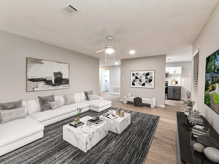 Large living area with wood-like floors