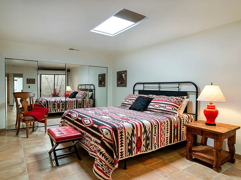 Guest Bedroom - King Bed - Iron Headboard, New King Mattress & remote controlled skylight shade.