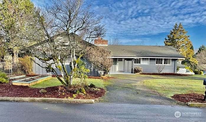 Front of the house. Parking is to the left of this tree. Entrance to downstairs is on the left of the house.