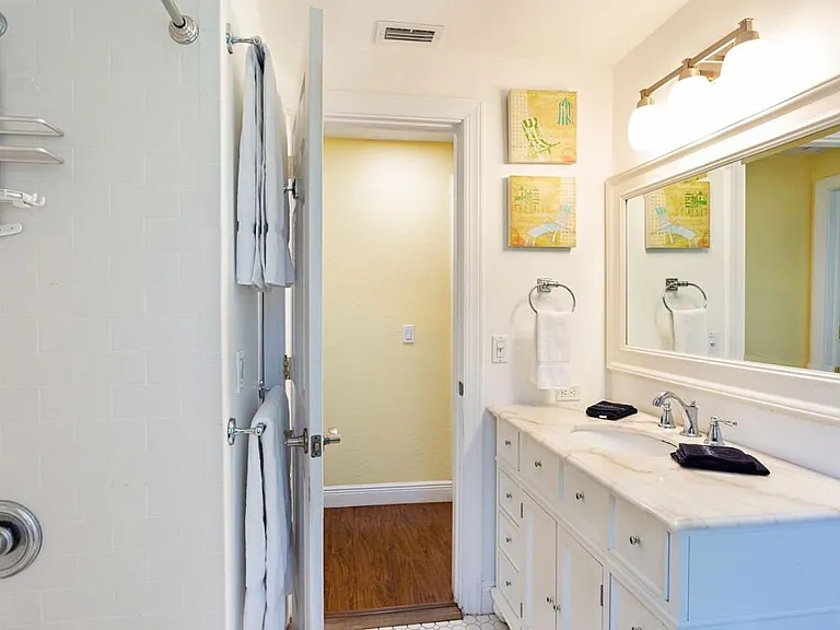 Second bathroom with view of hallway