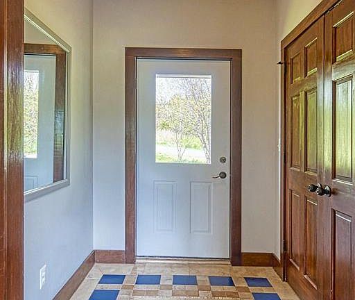 Air-lock Foyer is Energy Efficient. Beautiful Tile
