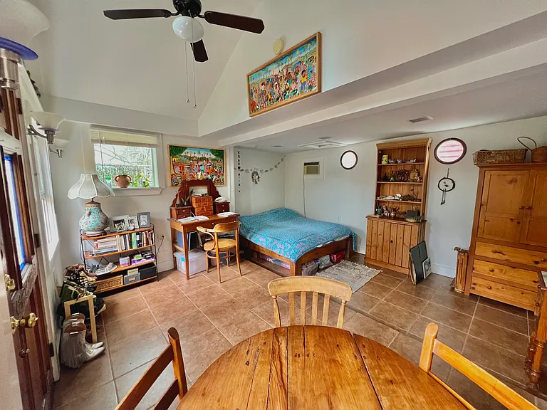 Space furnished with bed frame and mattress.
