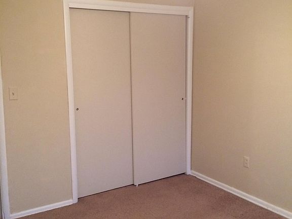 West Facing Bedroom with Ceiling Fan.
*window not shown* View faces West