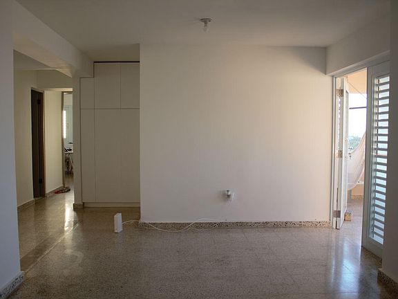 Once you enter, this is the first thing you see. To the right is the balcony, to the left is the hallway, open room (family), and kitchen. Note that this apartment was originally 3 bd, 2.5br. One (1)br and the half bathroom were taken out by previous owne