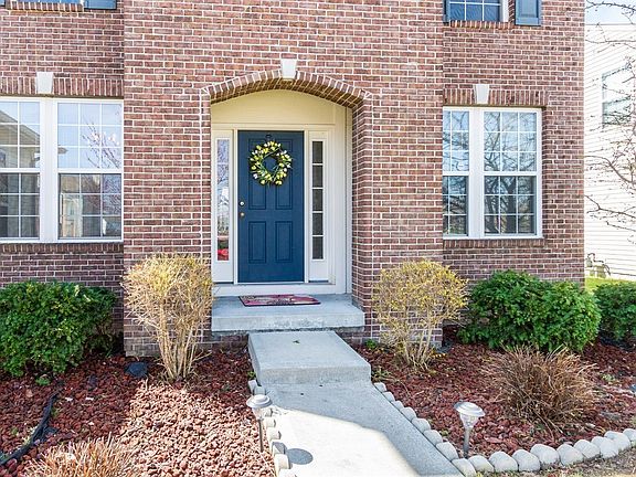 Gorgeous brick entry and covered porch!