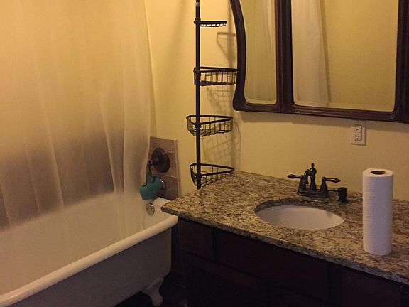 Granite vanity with French swing mirror