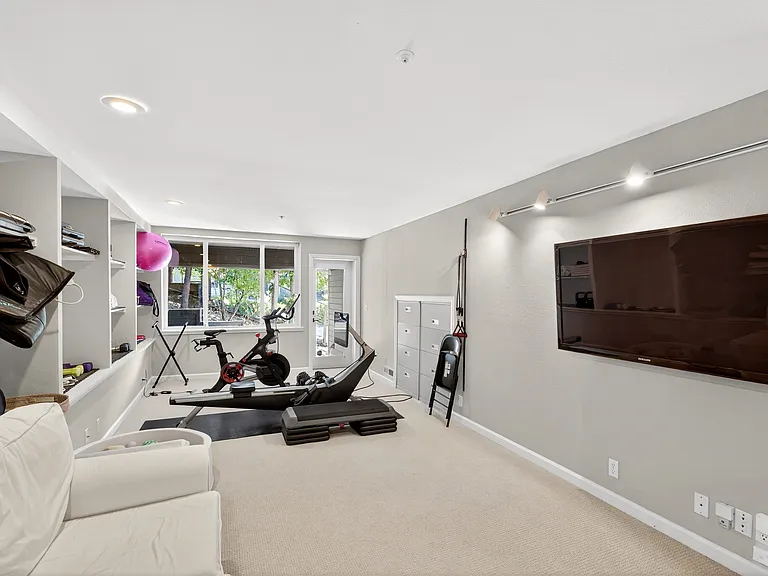 Multi-use room with private half bath and separate exterior access. Location: downstairs