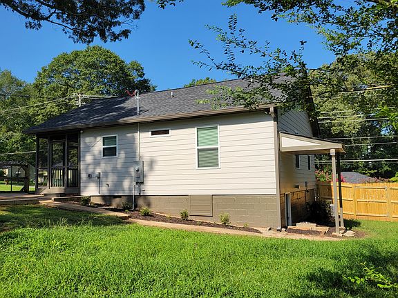 On a corner, double-lot with a fenced-in back yard. Covered access to a "crawlspace" (6' ceilings!) with plenty of room for storage.