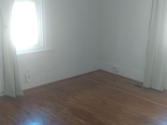 Wood floor larger bedroom